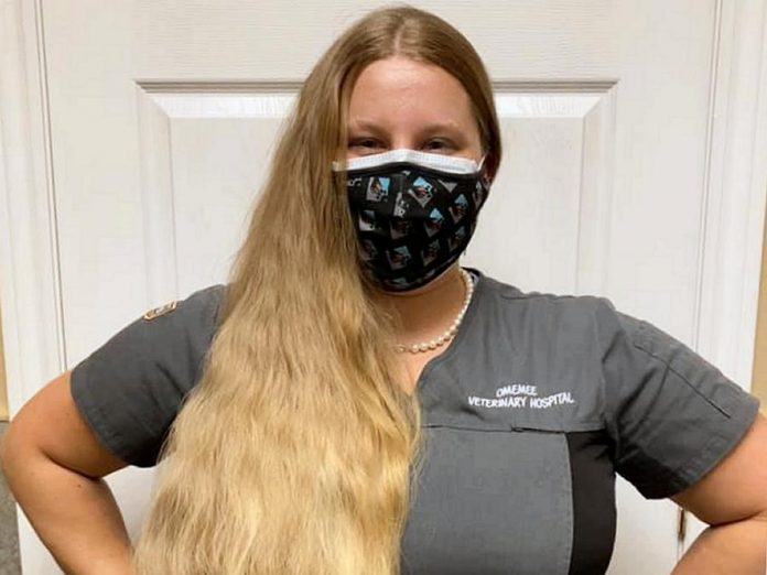 Britney Krzeminsk, a registered veterinary technician at Omemee Veterinary Hospital, is going to shave off all 28 inches of her hair in a fundraiser for the Brain Tumour Foundation of Canada. She has launched a crowdfunding campaign on Canada Helps. (Photo courtesy of Britney Krzeminsk)