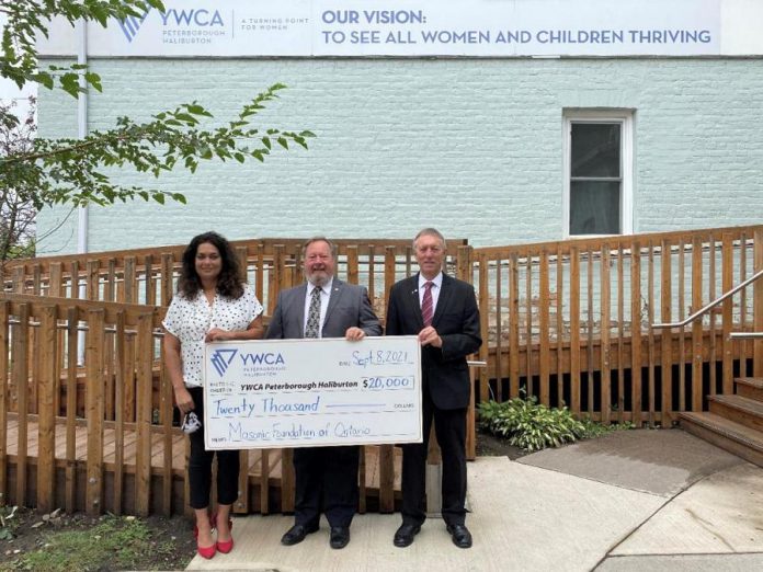 YWCA Peterborough Haliburton's Ria Nicholson accepts a $20,000 donation from the Peterborough District Masonic Association, presented by Tom Mortlock and Philip Lake. (Supplied photo)
