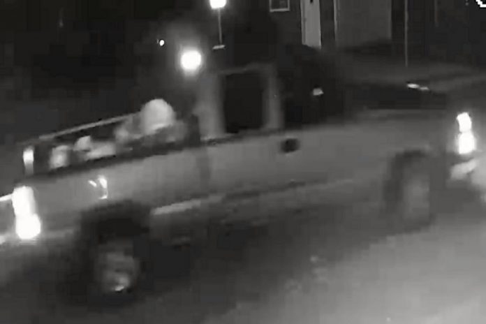 A black-and-white surveillance photo of the suspect's vehicle.  (Police-supplied photo)