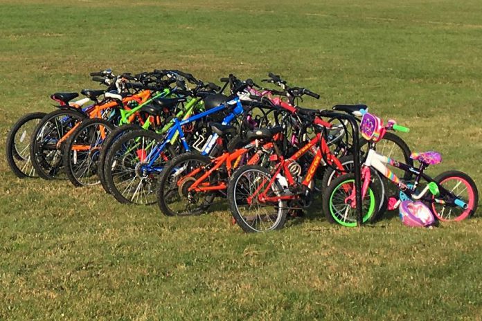 The Active School Travel Peterborough team likes to say that if you add racks, the bikes will fill them. Ideally, bike racks should be sheltered from rain and snow and located near pedestrian traffic areas. (Photo: Leif Einarson)