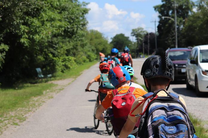 Participants in the Ecology Park Earth Adventures Camp learn how to navigate Peterborough by bike. Bike-friendly, walkable, and accessible infrastructure has the potential not only to reduce emissions but also to improve health indicators and sales for local businesses. (Photo: Jessica Todd)