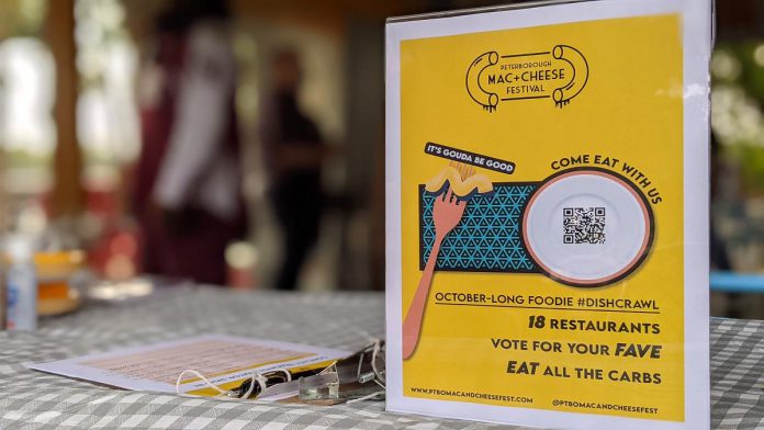  "It's gouda be good". A promotional sign during the launch event on September 21, 2021 for Peterborough's inaugural Mac + Cheese Festival during October. (Photo: Bruce Head / kawarthaNOW)