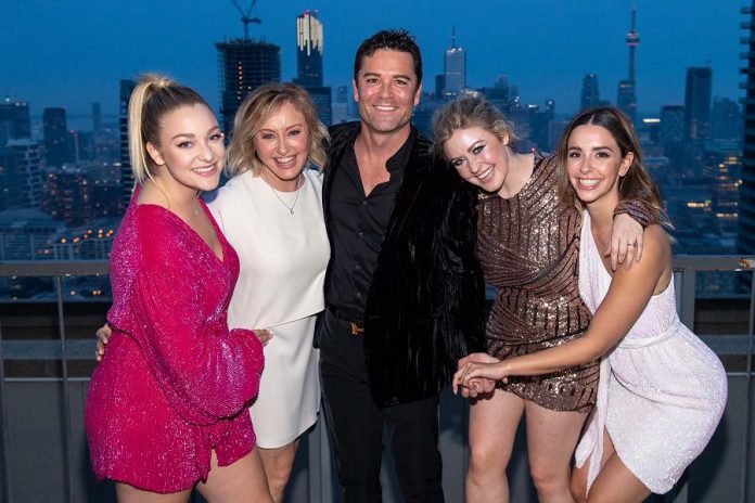 Shantelle Bisson and her husband Yannick Bisson, pictured with their daughters Mikaela (left), Brianna (middle right), and Dominique (right). The Bisson family has recently grown a member as Brianna's son Rory was born on August 22, 2021. (Photo: Ryan Emberley)