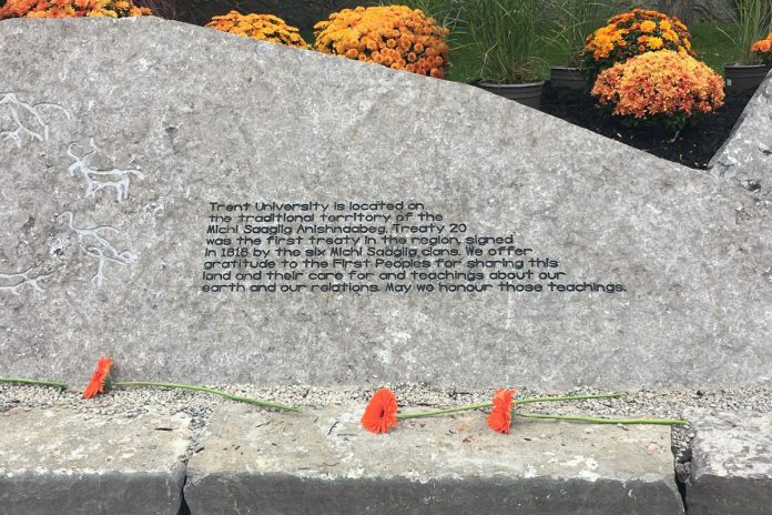 Unveiled at Trent University on the inaugural National Day for Truth and Reconciliation on September 30, 2021, the treaty rock is a new installation that recognizes the local treaty lands upon which the university is located. The installation is comprised of three limestone boulders, each bearing the symbols of the dodem (clan totem) carvings of the Treaty 20 Michi Saagiig signatories. (Photo: Paul Rellinger / kawarthaNOW)