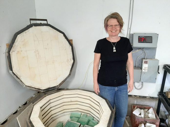 In addition to works of art, you can bid on unique art-related experiences during the Art Gallery of Peterborough's "It's All About ART" online auction from November 5 to 20, 2021, including a workshop with Peterborough glass and stone artist Christy Haldane, pictured here in her studio. (Photo courtesy of Christy Haldane)