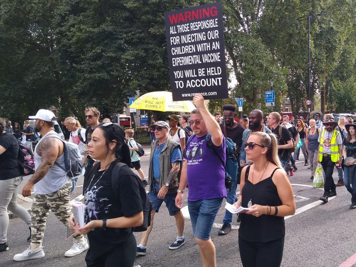 A combination of the highly transmissible delta variant and unvaccinated people is behind a substantial increase in COVID-19 cases compared to the same time last year, according to Peterborough Public Health. Pictured is a protest against COVID-19 vaccines in London UK on September 18, 2021. (Public domain photo)