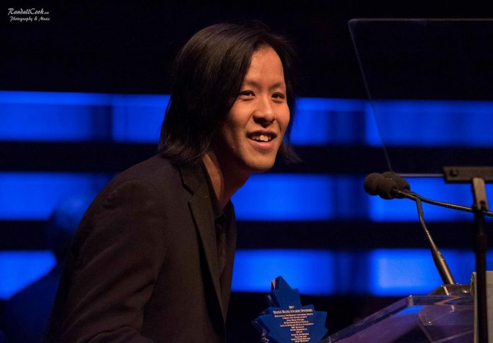 Jonny Wong accepting one of his four horn player of the year awards from the Toronto Blues Society. (Photo: Randall Cook)