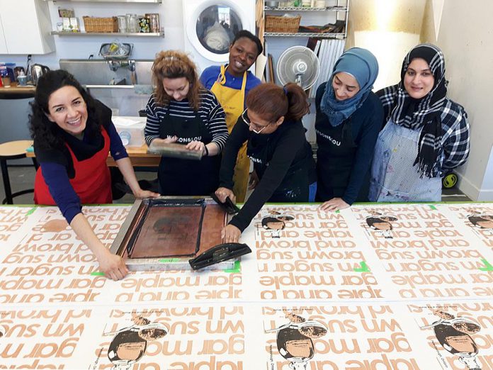 Under the umbrella of Madderhouse, the Newcomer Sewing Group is available for hire for businesses and organizations. The Newcomer Sewing Group is a social enterprise where the women involved receive fair compensation for their work while expanding their skills in creative entrepreneurship.  (Photo courtesy of Madderhouse Textile Studios)