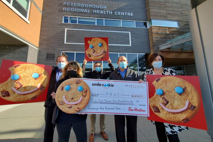 Representatives from Tim Hortons and the Peterborough Regional Health Centre (PRHC) Foundation celebrate raising $68,991.15 through the annual Tim Hortons Smile Cookie campaign to support mental health care services at the hospital. (Photo courtesy of PRHC Foundation)