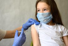 A young girl receiving a vaccination. (Stock photo)