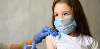 A young girl receiving a vaccination. (Stock photo)