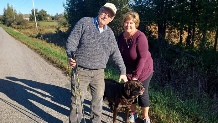 74-year-old Dave Graham of Bridgenorth is walking the equivalent of 225 kilometres by December in a fundraiser for cancer care for Peterborough Regional Health Centre — all while he continues to receive chemotherapy for his colon cancer. Graham, pictured here with a neighbour he met on one of his walks, has already raised more than $7,500. (Photo courtesy of Graham family)