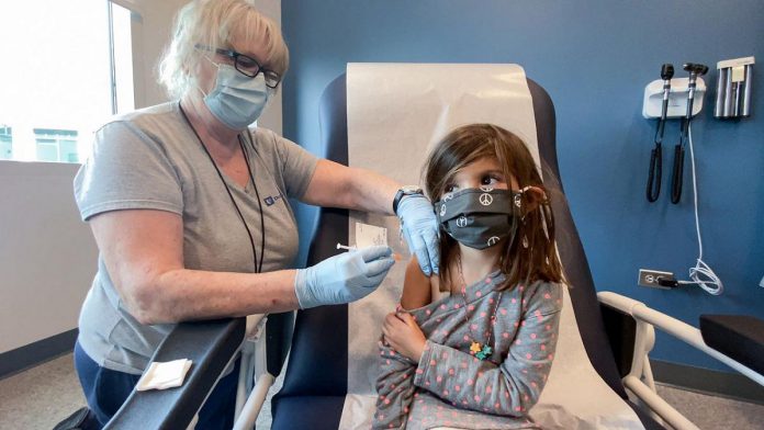Five-year-old Bridgette Melo receives the first of two Pfizer COVID vaccinations on September 28, 2021 during a clinical trial for children at Duke University in Durham, North Carolina. (Photo: Shawn Rocco / Duke Health via Reuters)