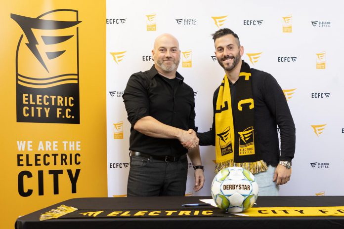 Electric City FC president Rob Jenkins welcomes Michael Marcoccia as the professional soccer club's first head coach and technical director. (Photo courtesy of Electric City FC)