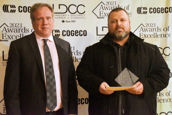 Mental health advocate Jon Perrin (right) accepts the citizen of the year award from Shawn Harris of IG Wealth Management, the award's sponsor, at the Lindsay and District Chamber of Commerce's Awards of Excellence celebration on November 12, 2021. (Photo: R.A. Bloom Creations)