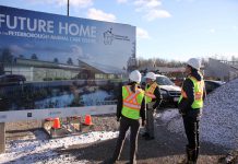 kawarthaNOW publisher Jeannine Taylor and writer Paul Rellinger were invited to a private onsite tour of the Peterborough Humane Society's existing location, which opened in 1956, and the new Peterborough Animal Care Centre, currently under construction and slated to open fall 2022. Pictured at the construction site are (left to right), Peterborough Humane Society corporate partnerships and marketing manager Julie Howe, Paul Rellinger, and Peterborough Humane Society executive director Shawn Morey. (Photo: Jeannine Taylor / kawarthaNOW)