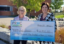 Judy Johnston of Peterborough accepts a cheque for $66,902.50 from Lesley Heighway, president and CEO of the Peterborough Regional Health Centre (PRHC) Foundation, which launched its first-ever 50/50 lottery in September 2021. The 50/50 lottery continues in November. (Photo courtesy of PRHC Foundation)