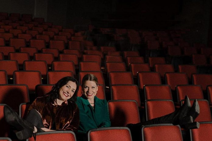 Megan Murphy and Kate Suhr enjoying the newly installed seats in the Erica Cherney Theatre at Showplace Performance Centre in downtown Peterborough. The duo will be welcoming audiences back to Showplace with their new show "Back Home for the Holidays", featuring music and stories to celebrate the season, on December 11 and 12, 2021. (Photo via The Verandah Society on Facebook)