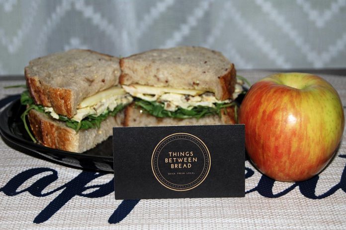 The Things Between Bread menu features some unique sandwiches made with locally sourced ingredients, including The Chicken with Curry Mayo, with sliced bartlett pear, arugula, and Spade & Spoon pear ginger jam on Happenstance quinoa sourdough bread. (Photo: April Potter / kawarthaNOW)