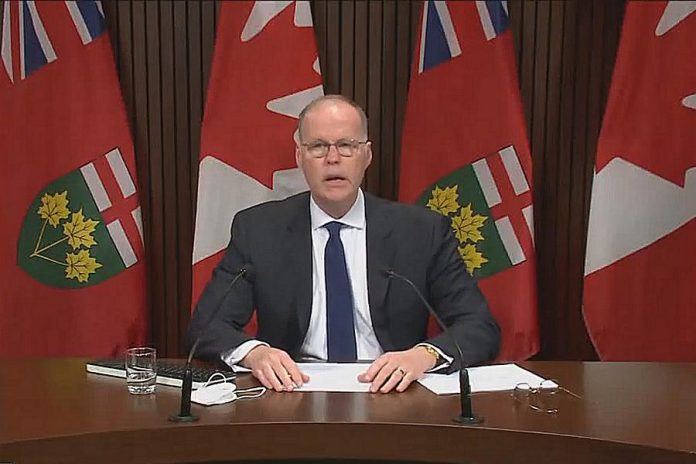 Adalsteinn Brown, co-chair of Ontario's science advisory table, presented the latest COVID-19 modelling projections based on the omicron variant during a media conference at Queen's Park in Toronto on December 16, 2021. (kawarthaNOW screenshot of CPAC video)
