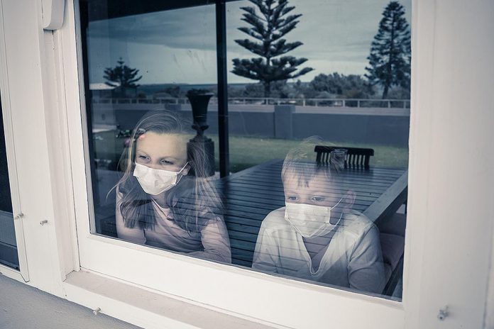 Children during a pandemic lockdown. (Stock photo)