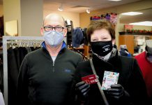 Gabi Hintelmann (right), the second early bird winner of the Holiday Shopping Passport program in downtown Peterborough, with John Martin, owner of John Roberts Clothiers where she purchased some Christmas presents for her family. Hintelmann will use her $500 Boro gift card to purchase toys from The Toy Shop to donate to YWCA Peterborough Haliburton. (Photo courtesy of The Boro / Peterborough DBIA)