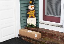A delivered package outside a door. (Stock photo)