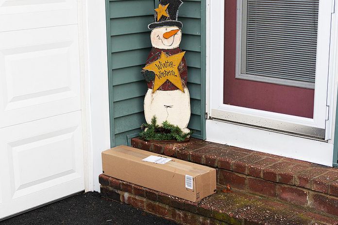 A delivered package outside a door. (Stock photo)