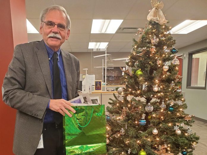 Andy Mitchell, deputy warden of Peterborough County and mayor of Selwyn Township, with a reusable gift bag. (Photo courtesy of Selwyn Township)