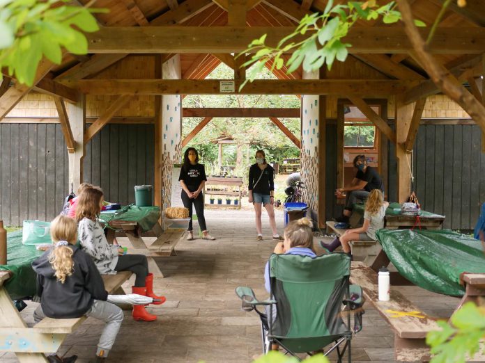 Jen Feigin, Dana Jordan, and Brianna Salmon (former executive director of GreenUP and current executive director of Green Communities Canada) discuss climate leadership with participants in the inaugural Girl's Climate Leadership Program at GreenUP Ecology Park in 2020. (Photo courtesy of GreenUP)