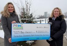 Mary Overholt of Peterborough (right) accepts a cheque for $39,855 from the Peterborough Regional Health Centre (PRHC) Foundation. Overholt won the grand prize in the November 50/50 lottery, and also chose an additional $2,000 in cash as her bonus prize. (Photo courtesy of PRHC Foundation)