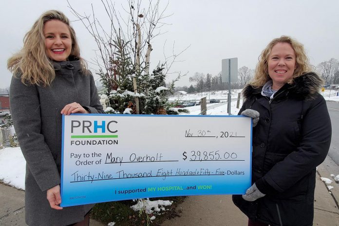 Mary Overholt of Peterborough (right) accepts a cheque for $39,855 from the Peterborough Regional Health Centre (PRHC) Foundation. Overholt won the grand prize in the November 50/50 lottery, and also chose an additional $2,000 in cash as her bonus prize. (Photo courtesy of PRHC Foundation)