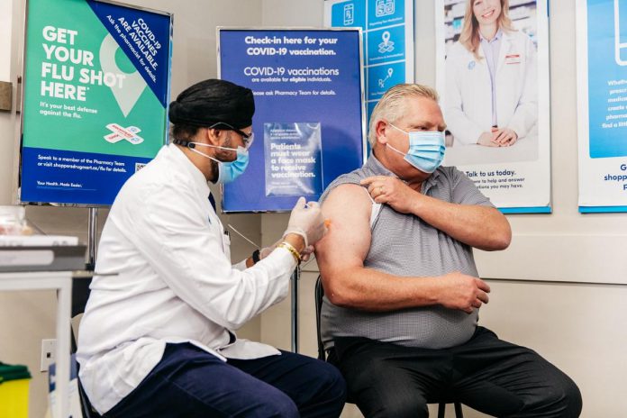Ontario Premier Doug Ford receiving his COVID-19 booster dose at an Etobicoke pharmacy on December 21, 2021. (Photo courtesy of Premier's Office)