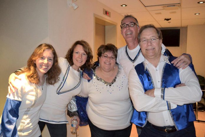 The late Barbara Monahan (centre) and members of The Peterborough Pop Ensemble pose in their costumes before one of their ABBA-themed performances before the pandemic. The group plans to bring back some ABBA music at their belated 20th anniversary concert scheduled to take place at Market Hall Performing Arts Centre in downtown Peterborough in April 2022. (Photo courtesy of the Peterborough Pop Ensemble) 