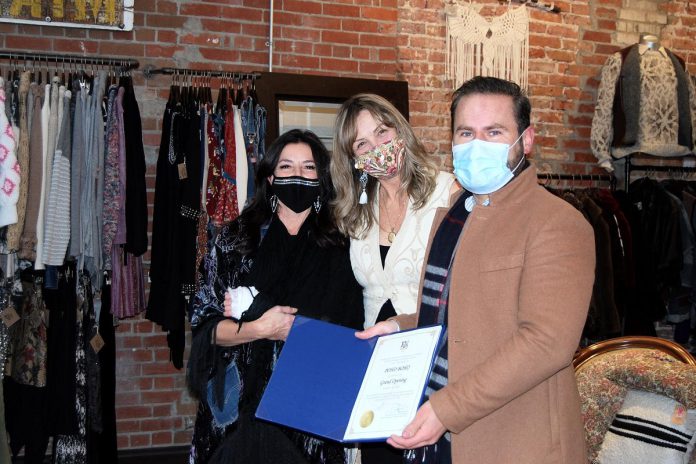 Northumberland-Peterborough South MPP David Piccini presents Poho Boho co-owners Kim Miller and Carolyn Scatterty with a certificate of recognition in honour of the shop's grand opening on November 26, 2021. (Photo: April Potter / kawarthaNOW)