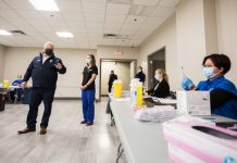 On December 24, 2021, the same day when Ontario reported a record-high 9,571 new COVID-19 cases, Premier Doug Ford toured a new mass vaccination clinic at the International Centre in Mississauga. At full capacity, this clinic will be able to administer approximately 19,000 vaccinations per day. The new mass vaccination clinic will be open seven days a week. (Photo: Premier's Office)