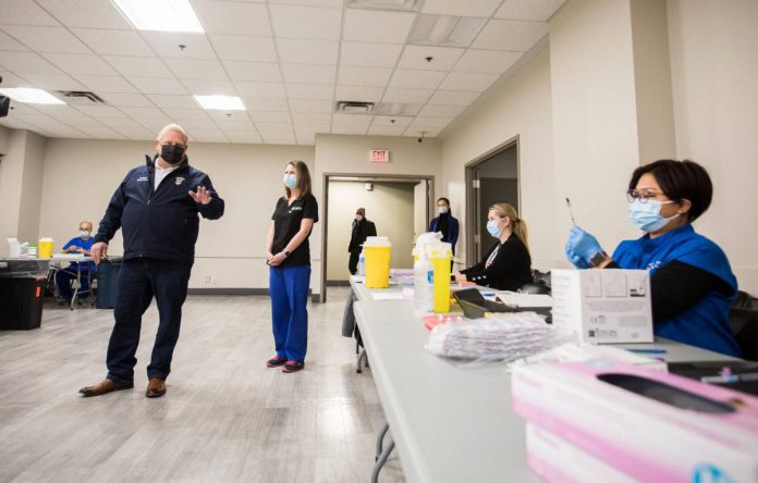 On December 24, 2021, the same day when Ontario reported a record-high 9,571 new COVID-19 cases, Premier Doug Ford toured a new mass vaccination clinic at the International Centre in Mississauga. At full capacity, this clinic will be able to administer approximately 19,000 vaccinations per day. The new mass vaccination clinic will be open seven days a week. (Photo: Premier's Office)