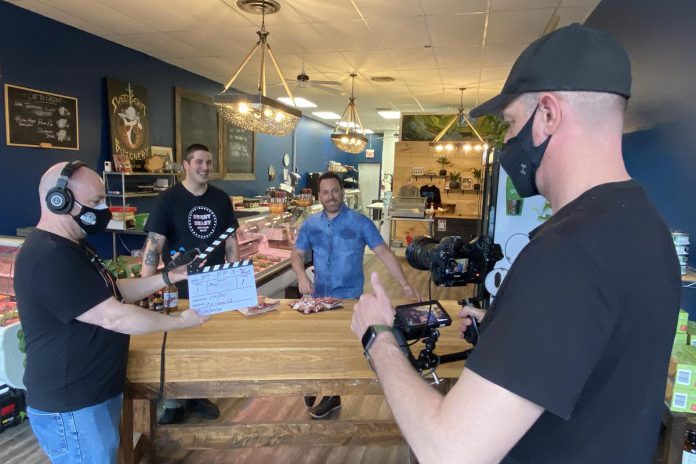 "Questionable Taste" co-director Kirk Comrie (left) and cinematographer Michael Hurcomb (right) with Grant Slavin of Sweet Beast Butcher Shop in Peterborough and host Ray Galletti in a segment for episode five. The cooking show also highlights some local food producers and suppliers in the Kawarthas. (Photo courtesy of Chad Maker)