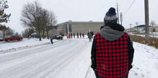 Peterborough-area residents wait outside the Healthy Planet Arena on December 27, 2021 for their COVID-19 booster shots. (Photo: Bruce Head / kawarthaNOW)