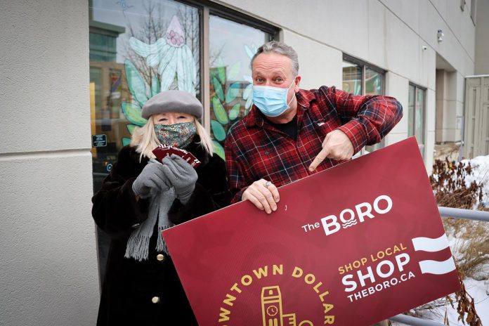 Holiday Shopping Passport grand prize draw winner Arlene Petrany of Peterborough and her grand prize of $1,500 in Boro gift cards with Peterborough DBIA executive director Terry Guiel. (Photo courtesy of Peterborough DBIA)