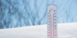 A thermometer in the snow showing a low of minus 35 degrees Celsius. (kawarthaNOW-modified stock photo)