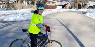 Cara Livingston commuting by bike on a nice sunny winter's day at -20°C. Before joining Winter Wheels, an annual program offered by B!KE: The Peterborough Community Bike Shop for people who have limited experience with winter riding, Cara only cycled in the winter if absolutely necessary. (Photo: Jacob Bozek)