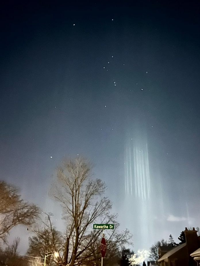 The Orion constellation appears above the light pillars in this photo. (Photo: Jim Webster)[