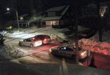 Police cars outside the personal residence of Peterborough medical officer of health Dr. Thomas Piggott on the evening of January 19, 2022. (Photo supplied to kawarthaNOW)