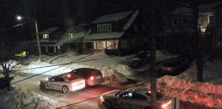 Police cars outside the personal residence of Peterborough medical officer of health Dr. Thomas Piggott on the evening of January 19, 2022. (Photo supplied to kawarthaNOW)