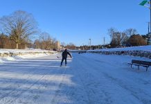 A lone skater has the ice to himself on the Trent Canal near the Peterborough Lift Lock early in the morning on January 14, 2022. With the green flag flying, the City of Peterborough has confirmed the ice is safe and skating is officially allowed. (Photo: Bruce Head / kawarthaNOW)