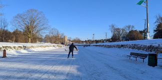 A lone skater has the ice to himself on the Trent Canal near the Peterborough Lift Lock early in the morning on January 14, 2022. With the green flag flying, the City of Peterborough has confirmed the ice is safe and skating is officially allowed. (Photo: Bruce Head / kawarthaNOW)