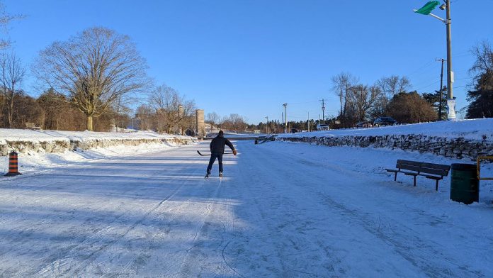 A lone skater has the ice to himself on the Trent Canal near the Peterborough Lift Lock early in the morning on January 14, 2022. With the green flag flying, the City of Peterborough has confirmed the ice is safe and skating is officially allowed. (Photo: Bruce Head / kawarthaNOW)
