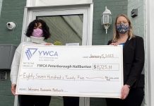 Christine Teixeira (right), president of the Women's Business Network of Peterborough, presents a cheque for $8,725.31 to Ria Nicholson, lead philanthropic advisor with YWCA Peterborough Haliburton. The funds, raised in December 2021 during the networking organization's annual holiday gala, will support the YWCA Crossroads Shelter for women and children fleeing violence and abuse. (Photo: Yvonne Porter)