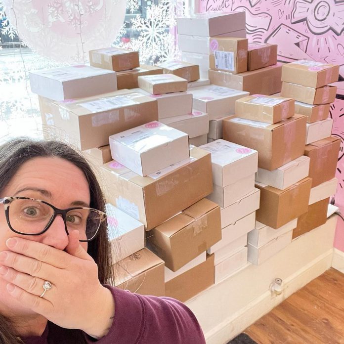 Couture Candy Ptbo owner Lisa Couture with some of the hundreds of online orders she has fulfilled after one of her TikTok videos went viral on February 25, 2022. (Photo: Lisa Couture)